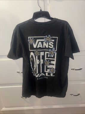 Vans Black Graphic Tee with White Logo and Smiling Flower Accents